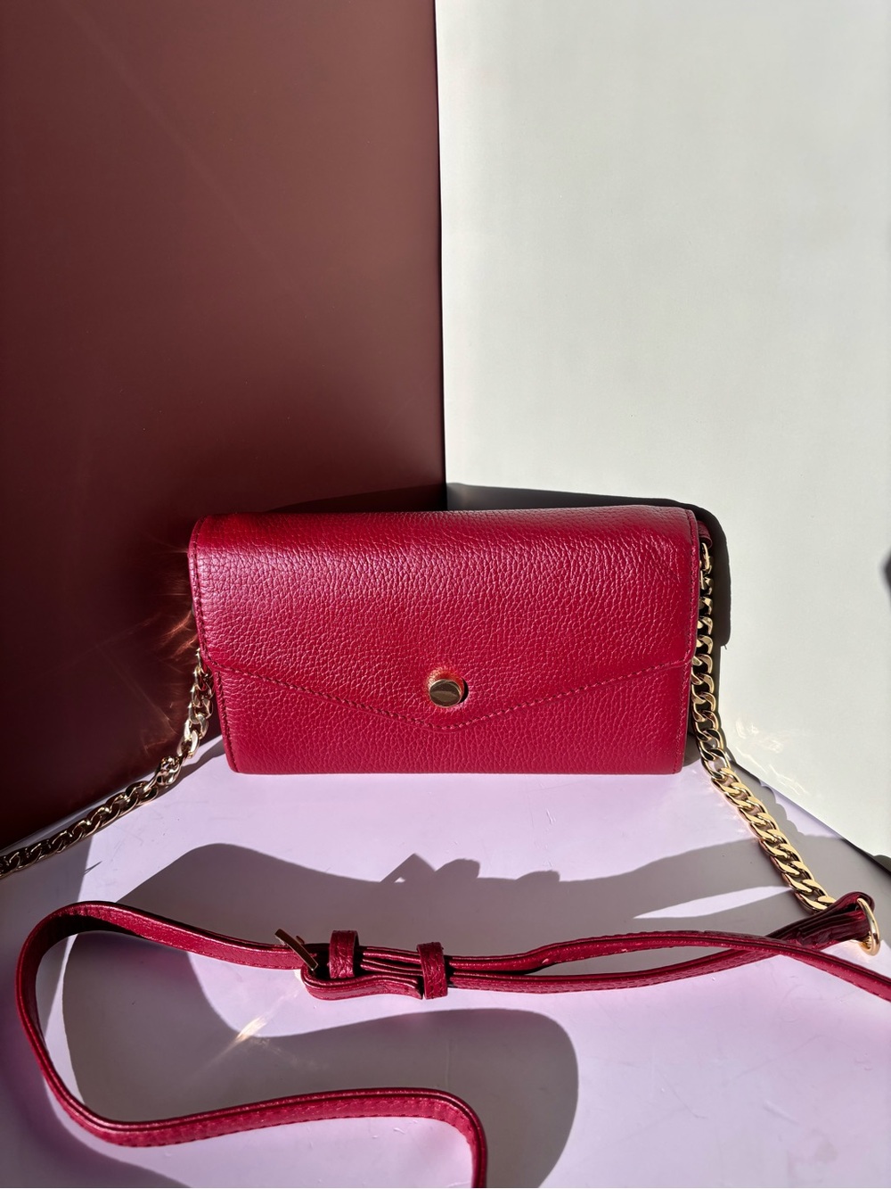 STELLA & MAX genuine red leather crossbody purse; a gold-toned chain strap